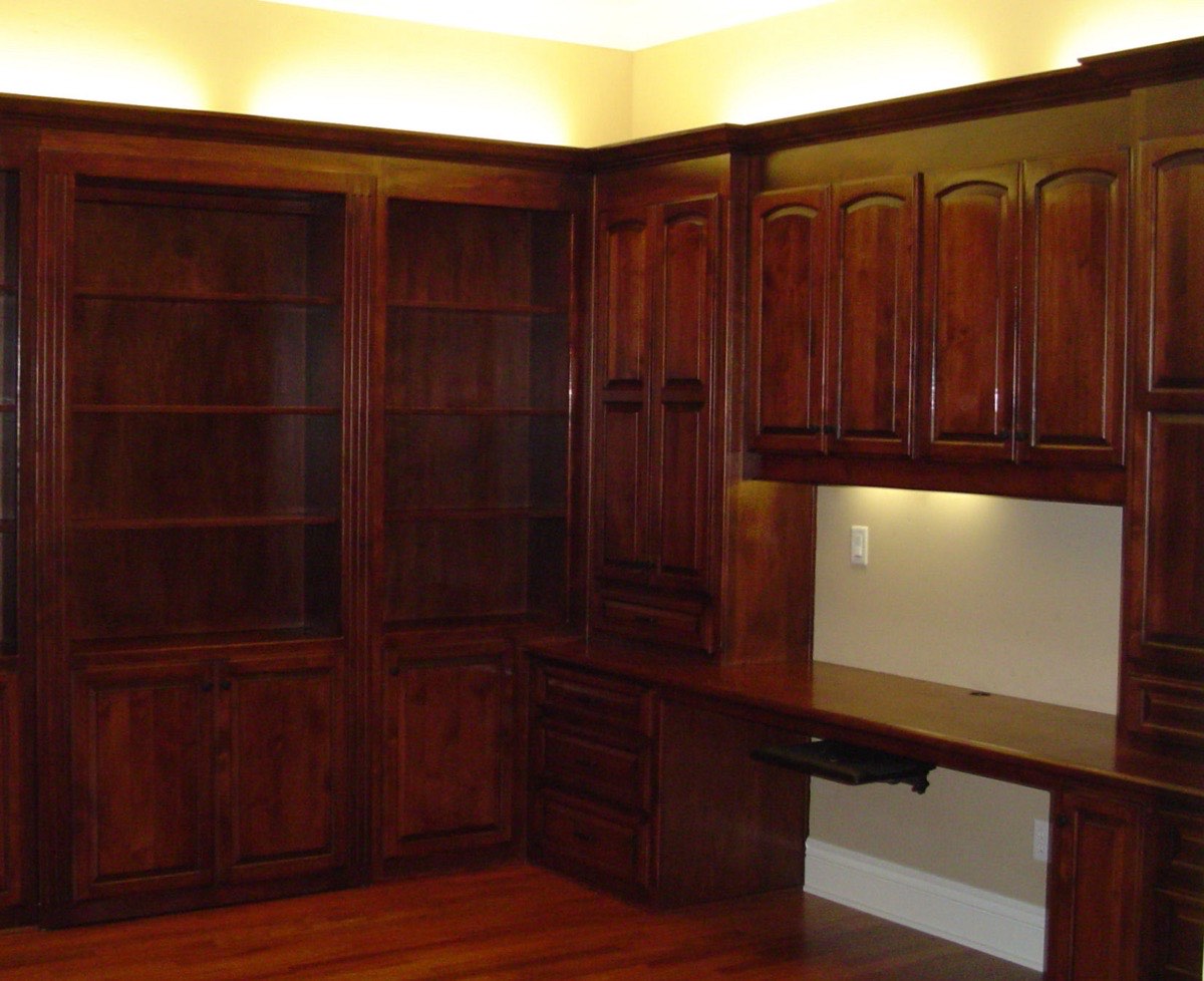 Built-in library shelving and desk with hidden door built by Caldwell Enterprise